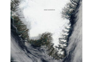 Photo-like satellite image of southern Greenland on the afternoon of September 4, 2022. Bare, dirty ice at the margin of the ice sheet appears gray. Snow-covered ice is bright white. Pale blue ribbons and circles are lakes, rivers and ponds of melt water. NASA image from Worldview